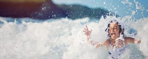 Impact-driven - picture of a girl in the surf