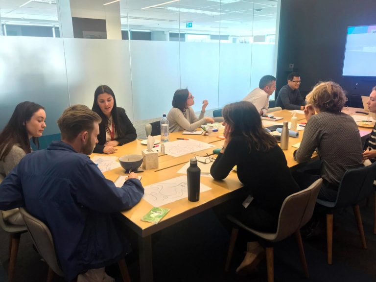 A group of people sitting around a table